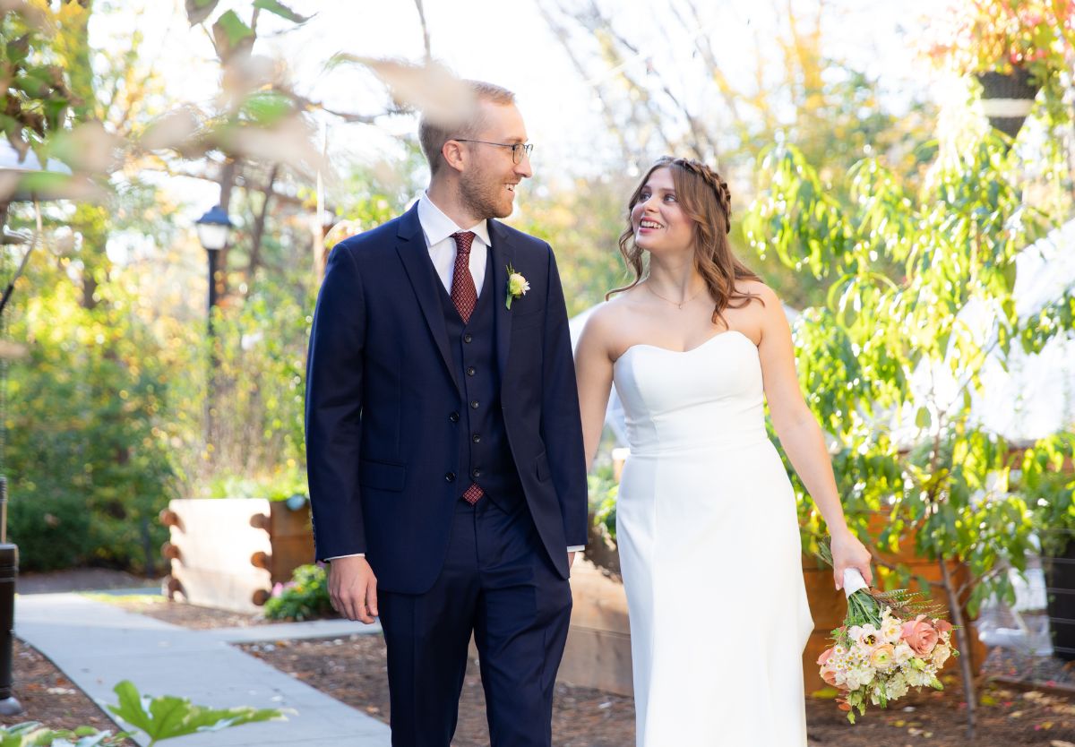 Married couple walking outside