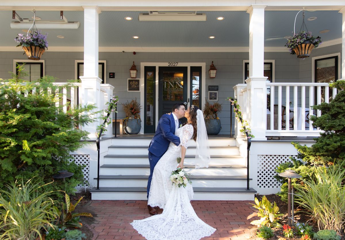 Married couple kissing outside