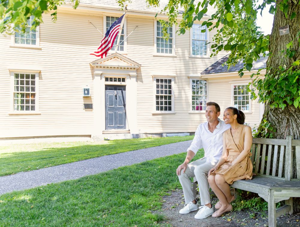 Couple sitting outside on bench