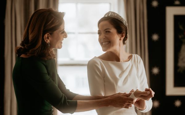 Two women smiling at each other