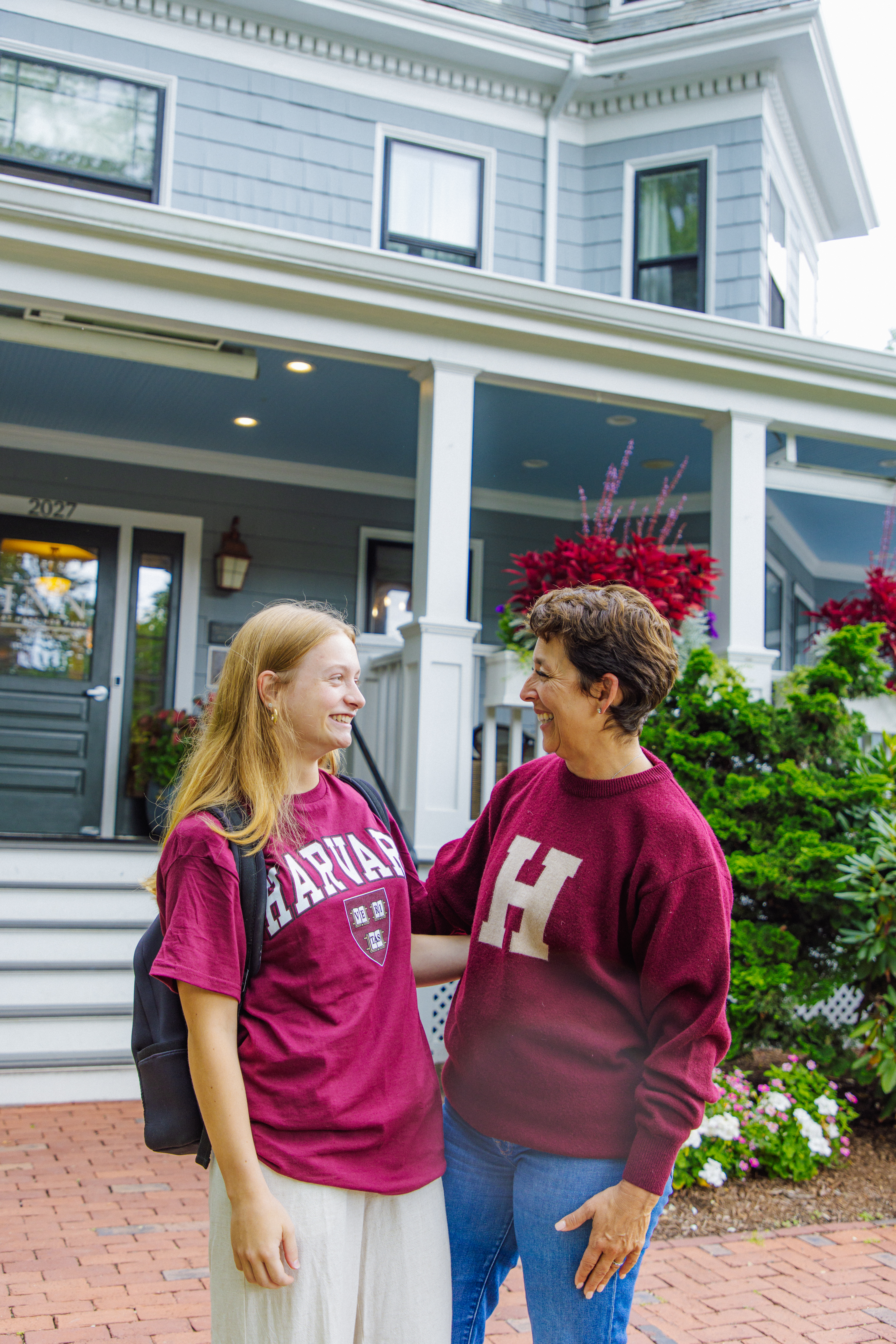 Mom and daughter with Harvard sweatshirts/ back to school