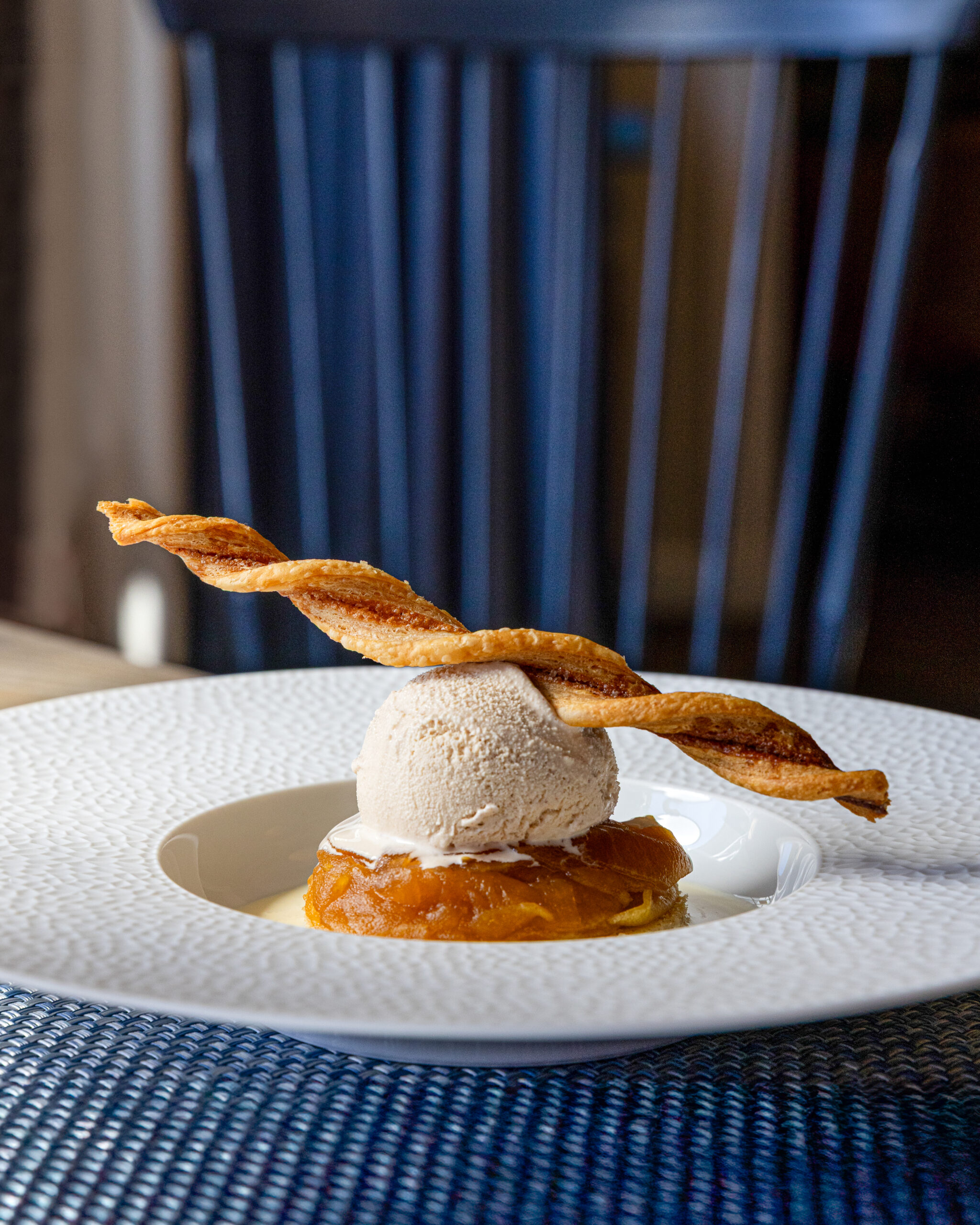 caramel apple dessert with philo pastry braided garnish and vanilla ice cream