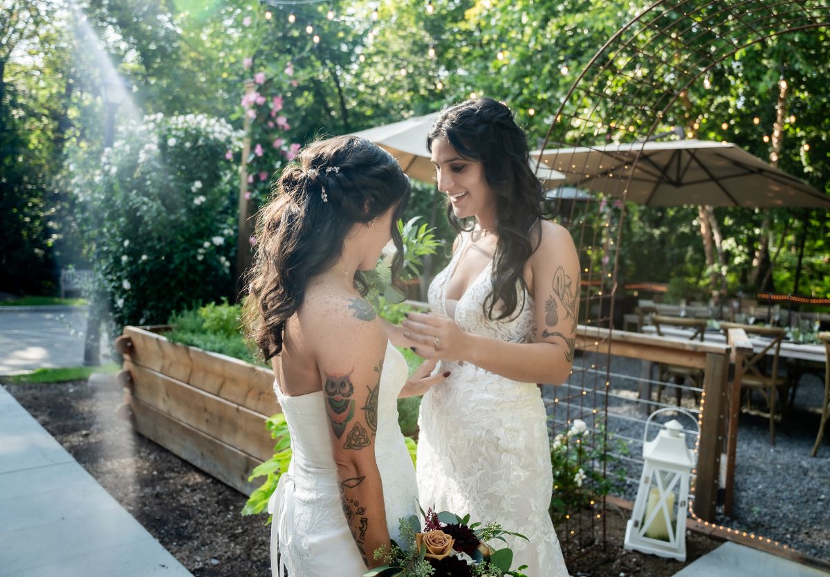 Brides facing each other outside