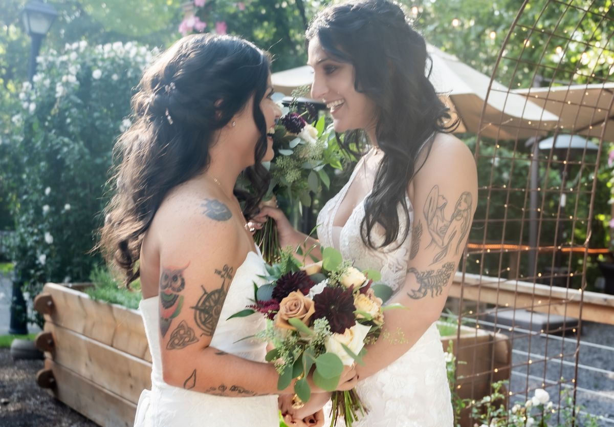 Brides smiling at each other