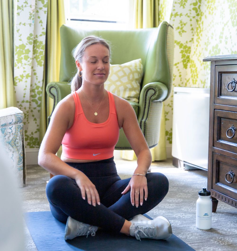 Women sitting and doing yoga