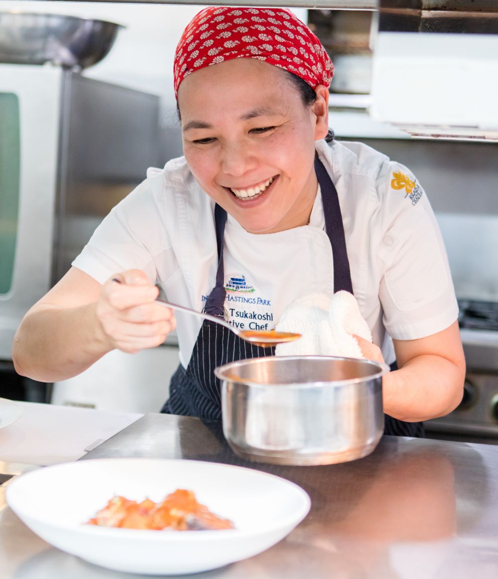 Woman serving food at the Inn at Hastings Park