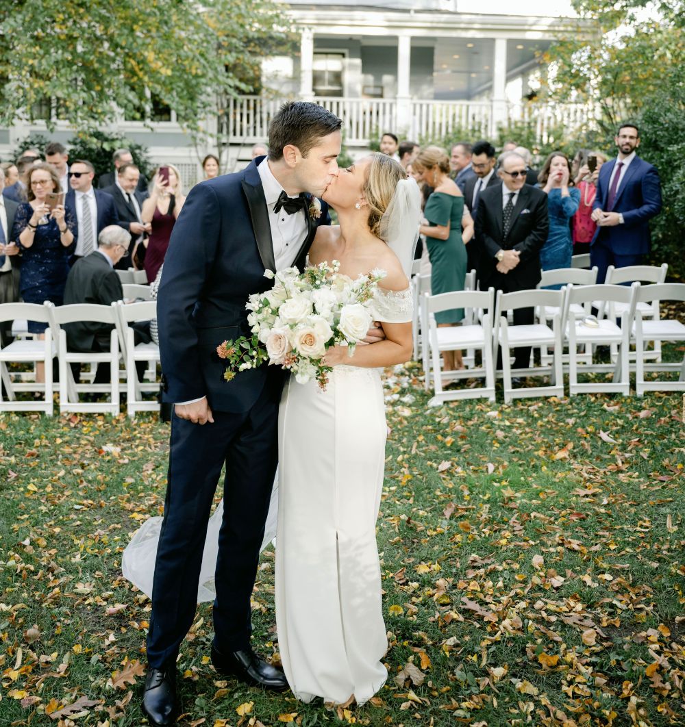 Couple kissing outside the Inn at Hastings Park